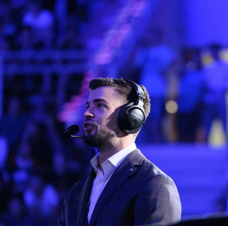 Daniel Kapadia commentating on stage at a Counter-Strike Major